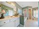 Elegant bathroom with double vanity, soaking tub, glass block window and a separate shower at 7420 Colony Ct, Cumming, GA 30041
