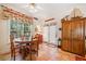 Breakfast nook featuring a table and chairs set, bright windows, and exterior access at 7420 Colony Ct, Cumming, GA 30041