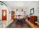 Formal dining room with hardwood floors, a wooden table, and a chandelier at 7420 Colony Ct, Cumming, GA 30041