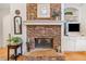 Living room stone fireplace and hearth at 7420 Colony Ct, Cumming, GA 30041