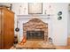Stone fireplace in a living room with a decorative mantel and hearth at 7420 Colony Ct, Cumming, GA 30041