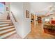 Foyer leading to an open-concept living space with stairs and tile flooring at 7420 Colony Ct, Cumming, GA 30041