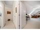 View of the hallway leading to bonus space with sloped ceilings at 7420 Colony Ct, Cumming, GA 30041