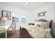 Cozy bedroom with natural light, neutral walls, and comfortable furnishings for a serene retreat at 7770 Sudbury Cir, Covington, GA 30014
