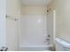 Bright bathroom featuring a standard white tub and shower combination at 811 Betsy Ross Trl, Hampton, GA 30228