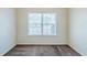 Neutral carpeted room, with white walls and trim, and a window with white blinds at 811 Betsy Ross Trl, Hampton, GA 30228