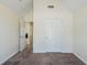 Clean, empty bedroom with neutral walls, carpet, and white trim and doors at 811 Betsy Ross Trl, Hampton, GA 30228