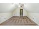 Finished bonus room with carpeting, dormer windows, and side storage at 811 Betsy Ross Trl, Hampton, GA 30228