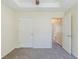 Neutral bedroom with tray ceiling, and white doors and trim at 811 Betsy Ross Trl, Hampton, GA 30228