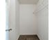 Walk-in closet featuring carpet and a hanging rack at 811 Betsy Ross Trl, Hampton, GA 30228