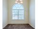 Bright dining area features large windows providing ample natural light and plush carpeting at 811 Betsy Ross Trl, Hampton, GA 30228