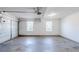 Spacious two-car garage with sealed concrete floor and windows at 811 Betsy Ross Trl, Hampton, GA 30228