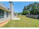 Home exterior featuring a spacious backyard with green grass at 811 Betsy Ross Trl, Hampton, GA 30228