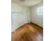 Empty bedroom with closet, hardwood flooring and window at 14 Craig Dr, Conyers, GA 30012