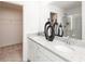 Modern bathroom with double sinks, granite countertop, and view to a shower at 1573 Aiden Way # 37, Conyers, GA 30013
