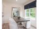 Dining area with a large window and a mirror on the wall at 1573 Aiden Way # 37, Conyers, GA 30013