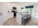 Well-equipped kitchen features granite counters, stainless appliances, and a bright breakfast bar, perfect for modern living at 1573 Aiden Way # 37, Conyers, GA 30013