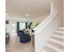 Open concept living space featuring a staircase, modern furnishings, and bright windows for a comfortable and stylish feel at 1573 Aiden Way # 37, Conyers, GA 30013