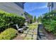 Beautiful backyard garden area with stone pavers and chairs at 4030 Spencer Green, Cumming, GA 30040