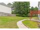 Spacious back yard with green grass and wooden fence, offering ample space and privacy at 1241 Hogan Ridge Ct, Grayson, GA 30017