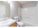 Bathroom featuring a single sink, toilet, and shower/tub combo at 1241 Hogan Ridge Ct, Grayson, GA 30017