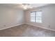 Bedroom with plush carpeting, neutral walls and ample natural light from a window at 1241 Hogan Ridge Ct, Grayson, GA 30017