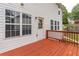 A wooden deck with rails offers scenic views and an outdoor space for relaxation at 1241 Hogan Ridge Ct, Grayson, GA 30017