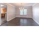 Dining room featuring dark hardwood floors and a traditional chandelier at 1241 Hogan Ridge Ct, Grayson, GA 30017