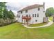 A charming two-story house with a lush green lawn and a quaint wooden fence at 1241 Hogan Ridge Ct, Grayson, GA 30017