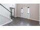 Bright foyer with hardwood floors, staircase, and double doors with window inserts at 1241 Hogan Ridge Ct, Grayson, GA 30017