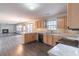 Open concept kitchen with stone countertops and stainless steel appliances at 1241 Hogan Ridge Ct, Grayson, GA 30017