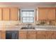Kitchen featuring stone counters and gold mosaic tile backsplash at 1241 Hogan Ridge Ct, Grayson, GA 30017