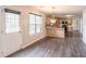View of kitchen with stone counters adjacent to door to back porch at 1241 Hogan Ridge Ct, Grayson, GA 30017