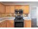 Kitchen boasting stainless steel appliances and stone countertops at 1241 Hogan Ridge Ct, Grayson, GA 30017