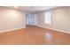Open-plan living area with tile floors, neutral walls and natural light at 1241 Hogan Ridge Ct, Grayson, GA 30017