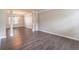 Spacious living room with hardwood floors, decorative columns, and abundant natural light at 1241 Hogan Ridge Ct, Grayson, GA 30017