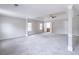 Spacious carpeted main bedroom with tray ceiling, ceiling fan, and en suite bathroom access at 1241 Hogan Ridge Ct, Grayson, GA 30017