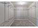 Large walk-in closet with shelving and carpet flooring, ready for organization and storage solutions at 1241 Hogan Ridge Ct, Grayson, GA 30017