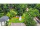 Aerial view of a fenced-in backyard with a lush green lawn, a storage shed, and a neighboring train track at 2037 Lenox Ne Rd, Atlanta, GA 30324