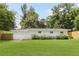 Large backyard with manicured lawn and surrounding trees providing privacy and a tranquil setting at 2037 Lenox Ne Rd, Atlanta, GA 30324