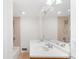 Bright bathroom boasts double sinks with a large mirror, and a bathtub with tiled walls at 2037 Lenox Ne Rd, Atlanta, GA 30324