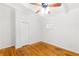 Bedroom with hardwood floors, closet and light from the window with white trim and walls at 2037 Lenox Ne Rd, Atlanta, GA 30324