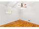 Bedroom featuring hardwood floors, a ceiling fan and ample light from the windows at 2037 Lenox Ne Rd, Atlanta, GA 30324