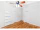 Bedroom featuring hardwood floors, closet, built-in bookshelves and bright white trim at 2037 Lenox Ne Rd, Atlanta, GA 30324