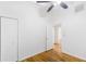 Neutral bedroom features hardwood floors and an open doorway to the rest of the home at 2037 Lenox Ne Rd, Atlanta, GA 30324