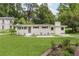 Charming single-story home featuring a well-maintained lawn, neutral-colored exterior, and classic architectural details at 2037 Lenox Ne Rd, Atlanta, GA 30324
