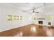 The living room features hardwood floors, a fireplace, white trim and walls, and lots of natural light at 2037 Lenox Ne Rd, Atlanta, GA 30324