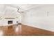 Light filled living room features a fireplace, hardwood floors, and white trim and walls at 2037 Lenox Ne Rd, Atlanta, GA 30324