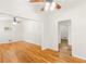 Bright living room featuring hardwood floors, ceiling fans, and freshly painted walls with multiple entryways at 2037 Lenox Ne Rd, Atlanta, GA 30324