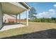 A well-manicured backyard with a covered patio and seating, ideal for outdoor relaxation at 2526 Knob Creek Dr, Snellville, GA 30078